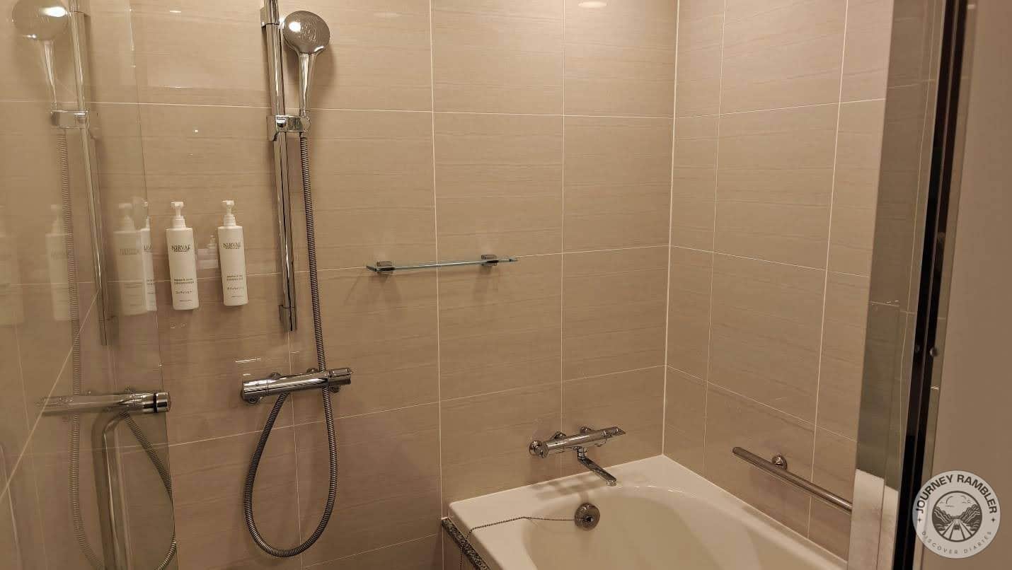 bathtub and a hand shower