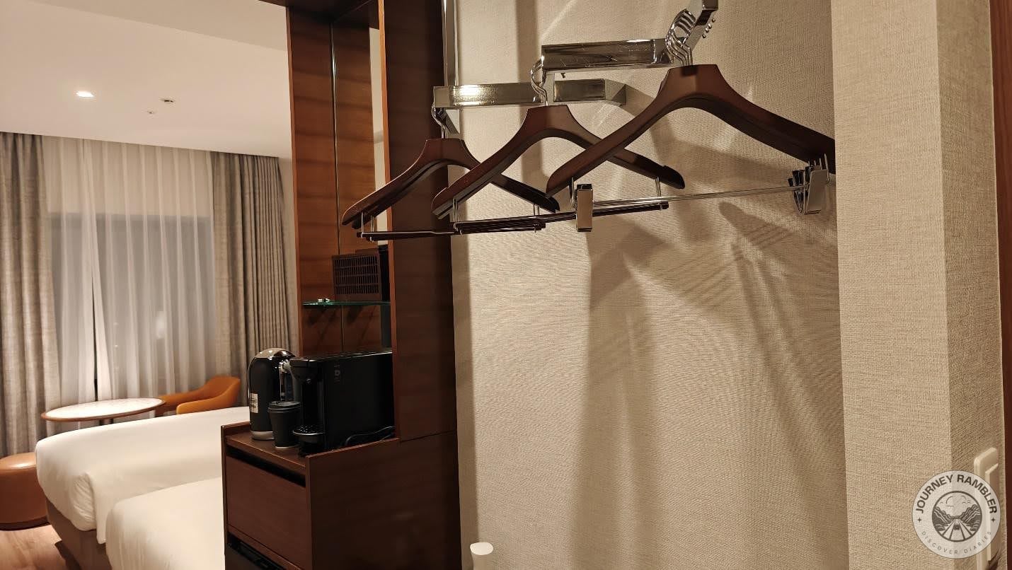 clothes hangers on the racks just inside the door