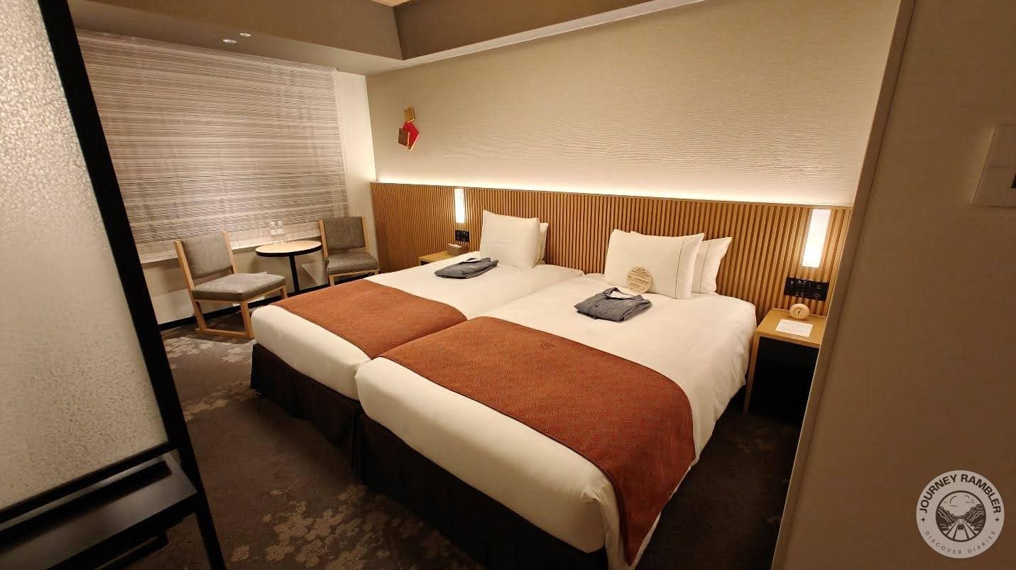 coffee table and two chairs were arranged in front of the large window