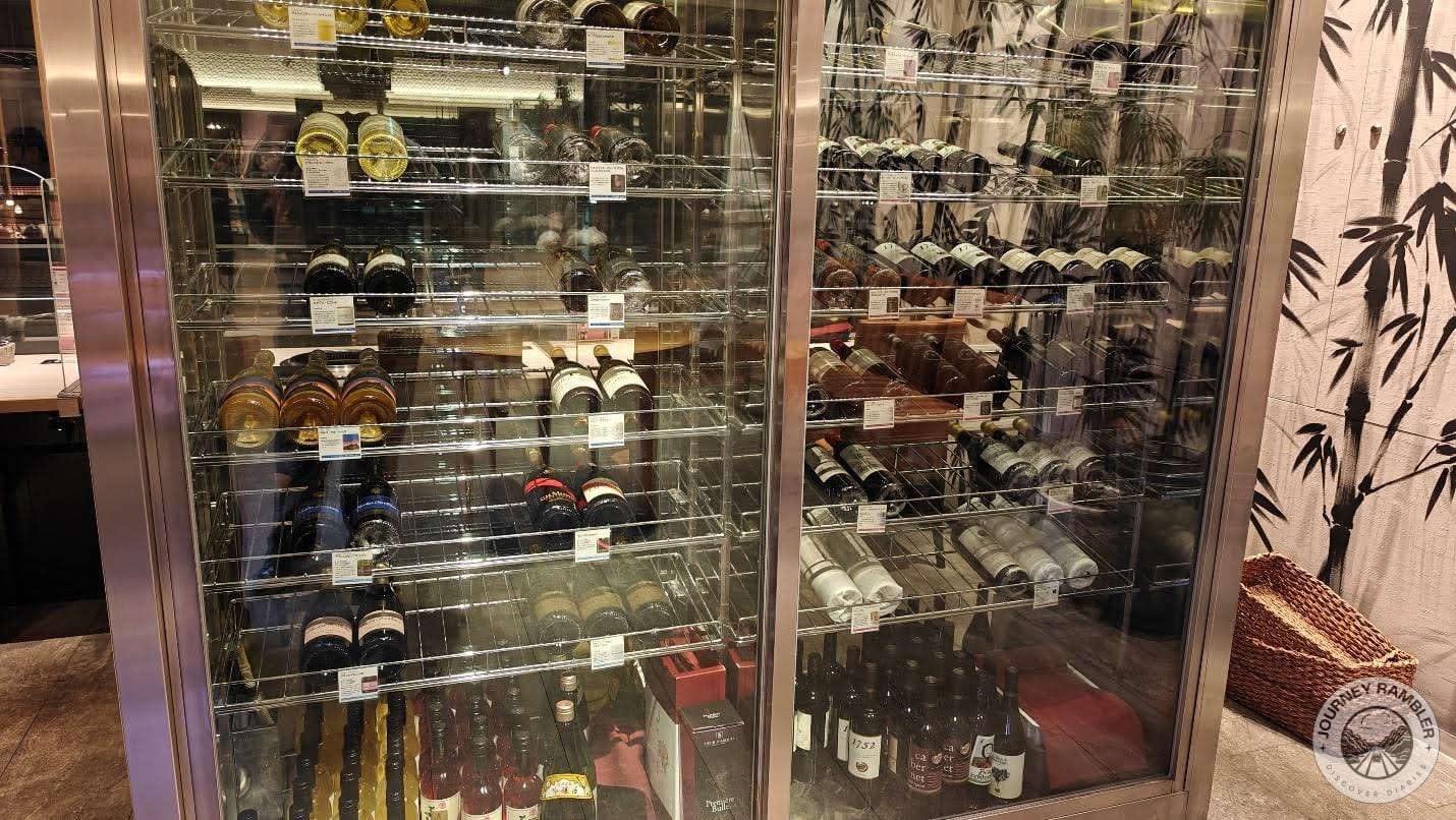 cooler filled with bottles and bottles of wine