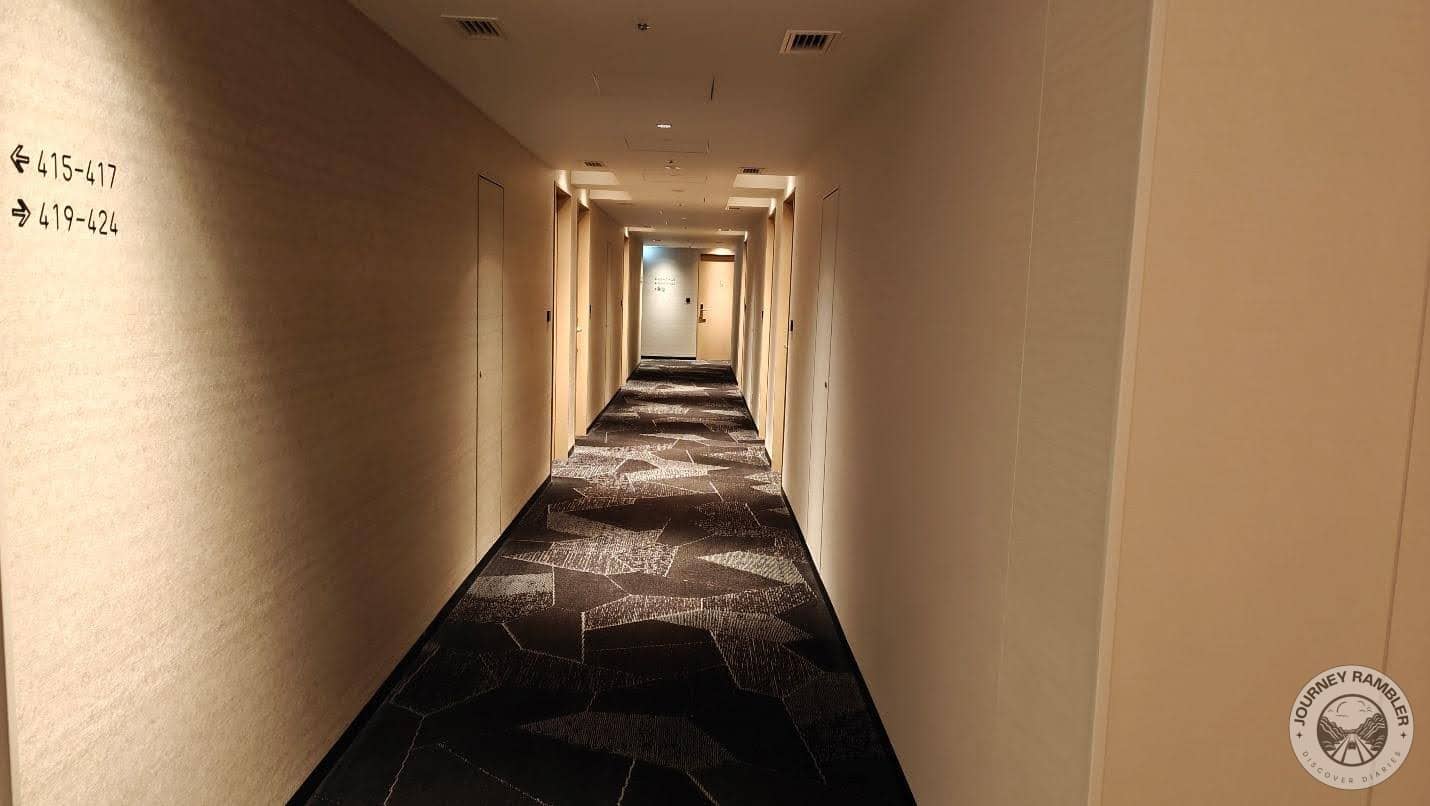 corridor was decorated in neutral but boring shades of brown and beige