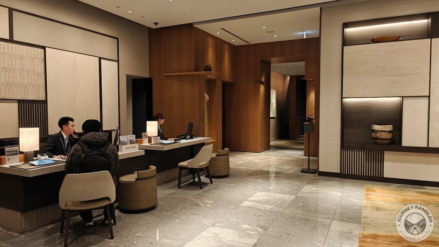 hotel staff were seated at the reception desk