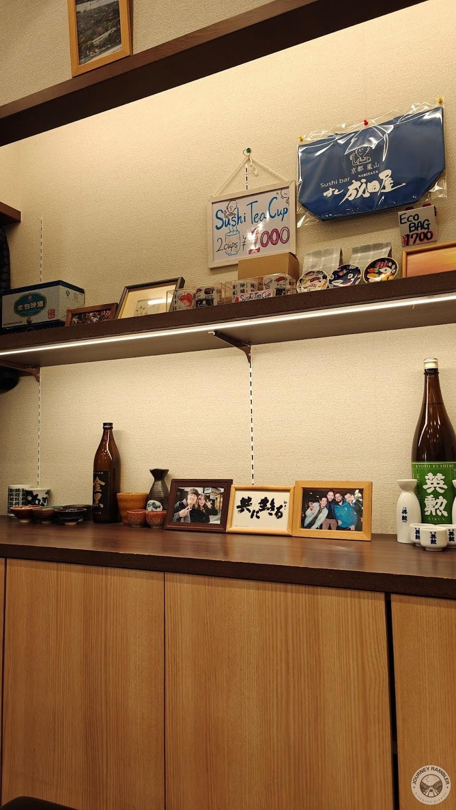 little knick-knacks and photo frames on the cabinets along the wall