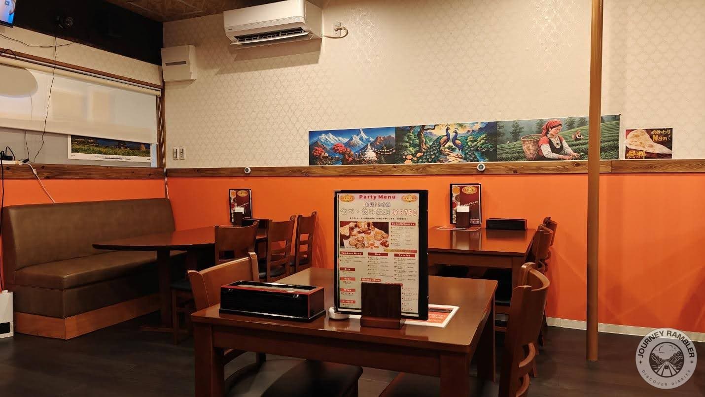 paintings of the Himalayas, peacocks and tea gardens on the walls