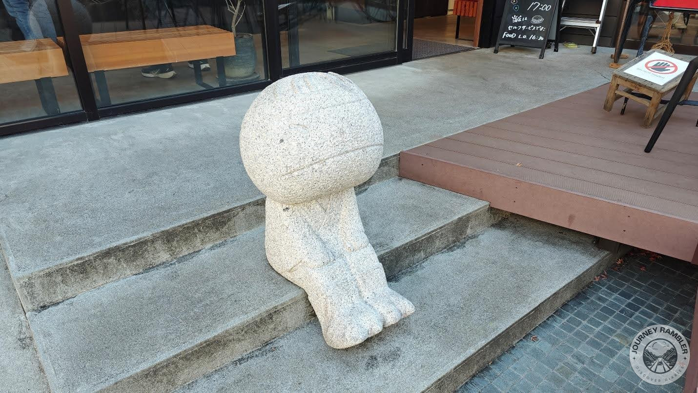 statue of a child that was seated