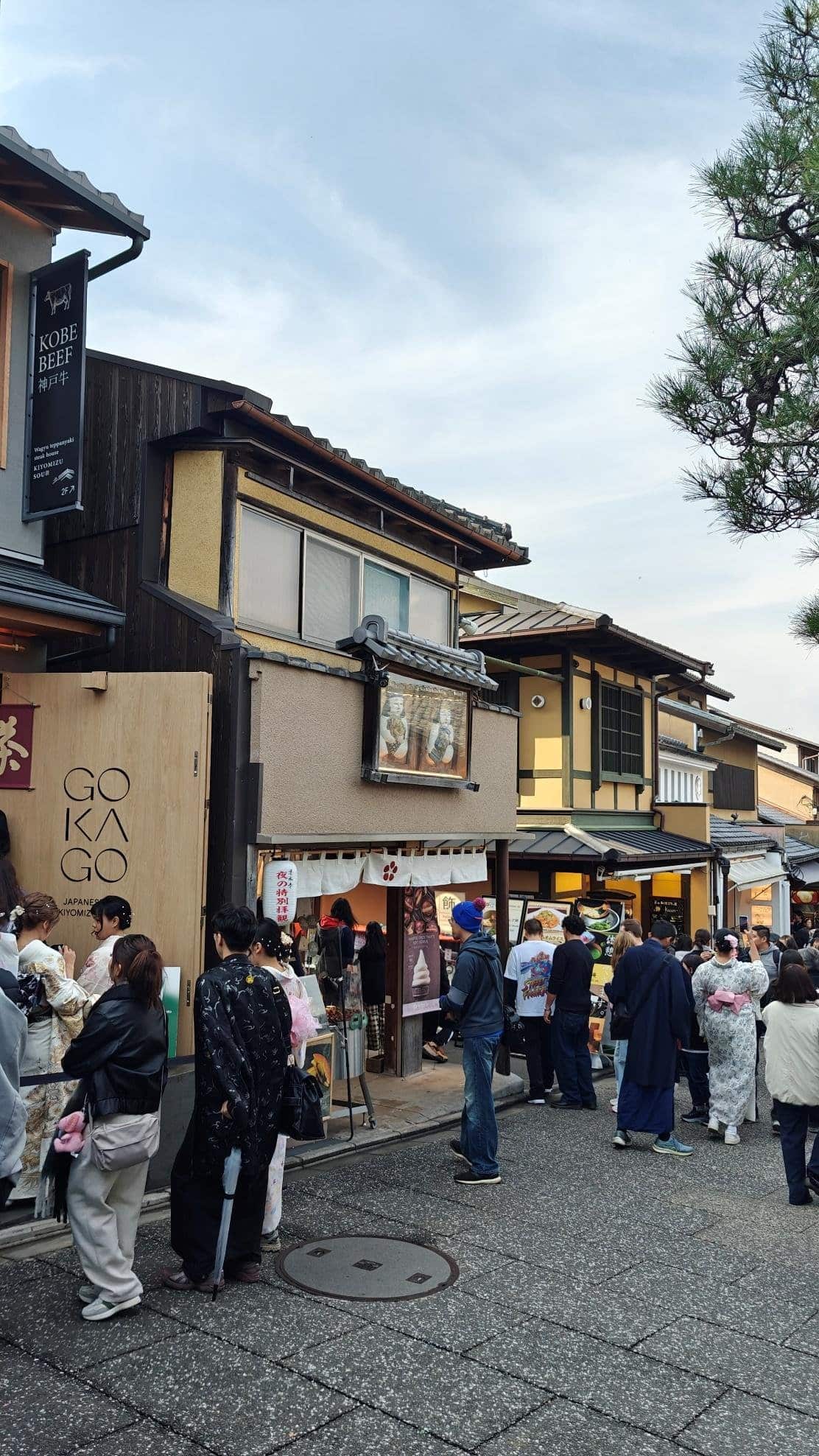 Busy street scene with people in traditional attire