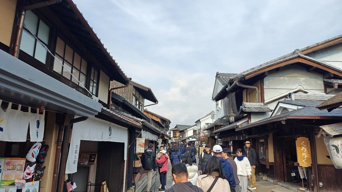 Busy street with traditional Japanese buildings and tourists