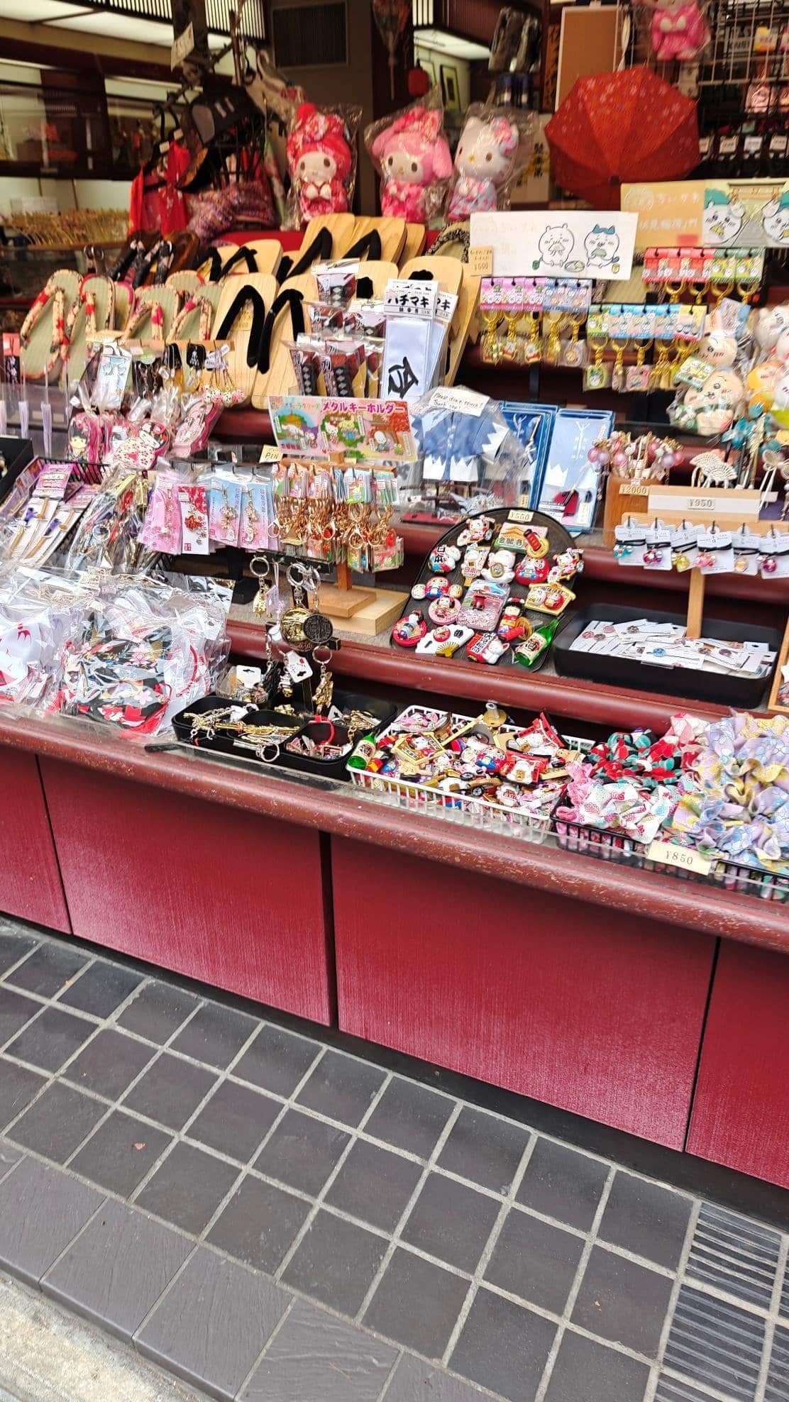 Colorful souvenir shop display with sandals and plush toys