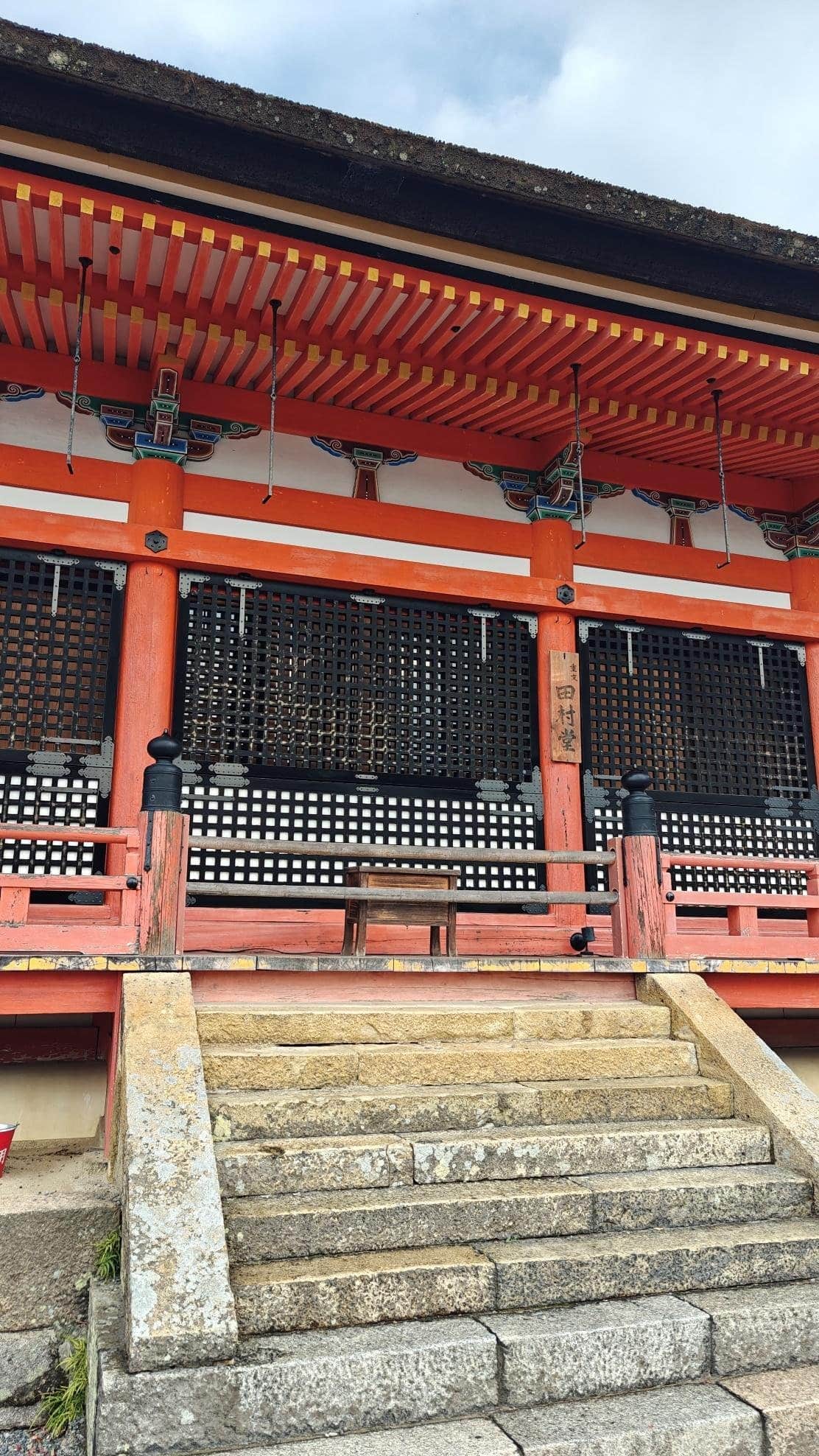 Colorful temple architecture with steps and intricate woodwork