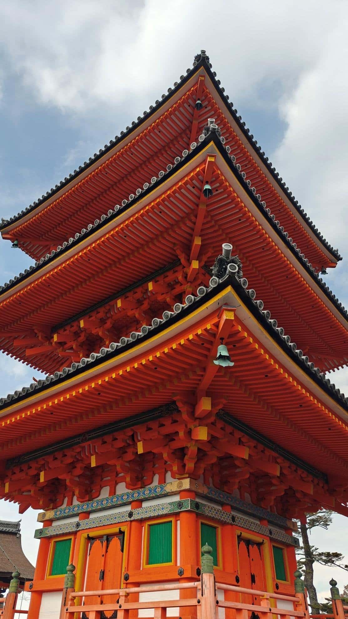 Colorful traditional Japanese pagoda against cloudy sky