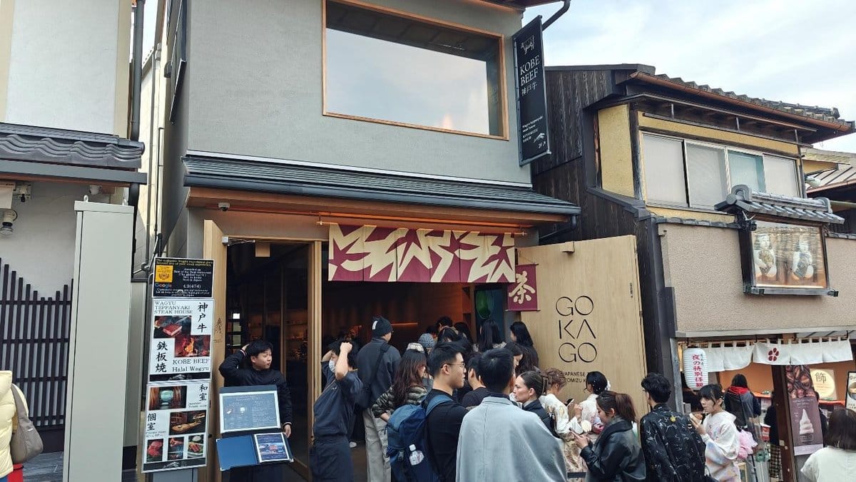 Crowd outside a Japanese restaurant with traditional decor