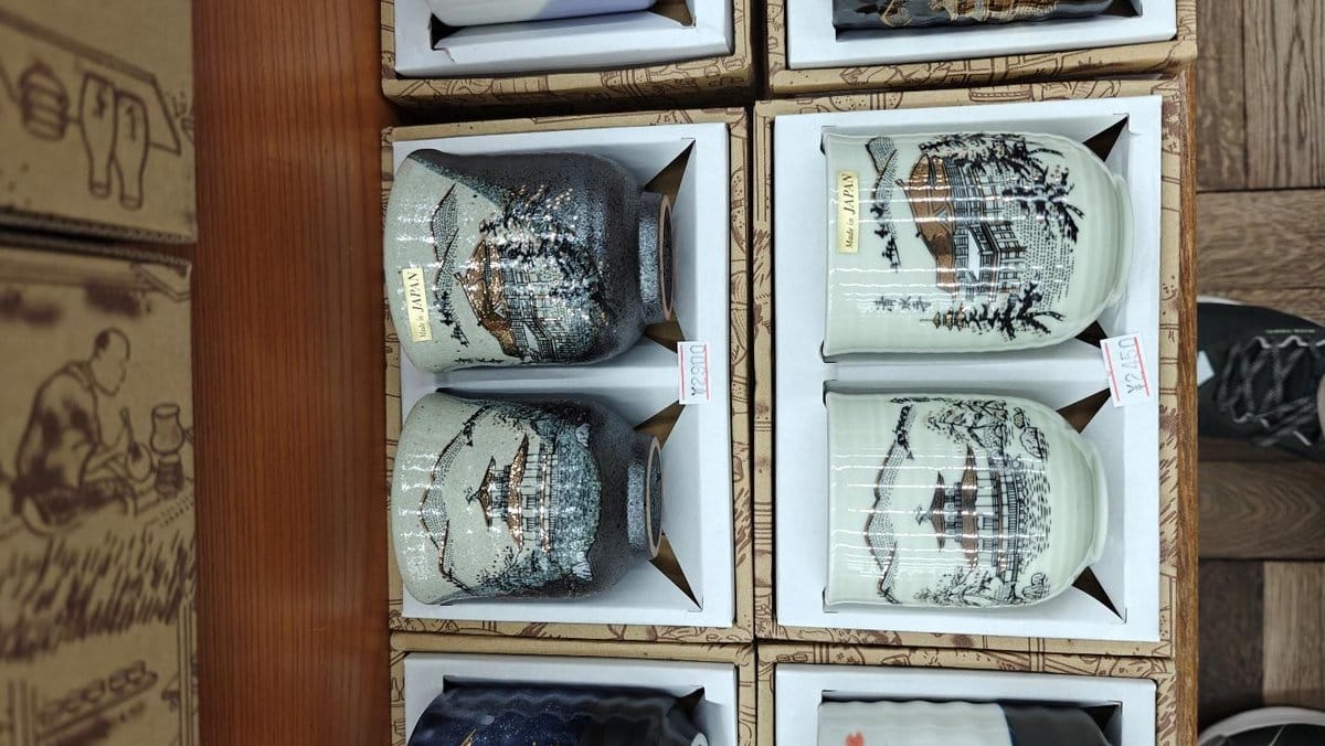 Decorative Japanese ceramic mugs in a box display