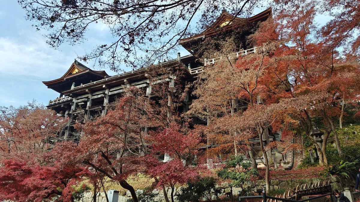 Historic temple with vibrant autumn foliage