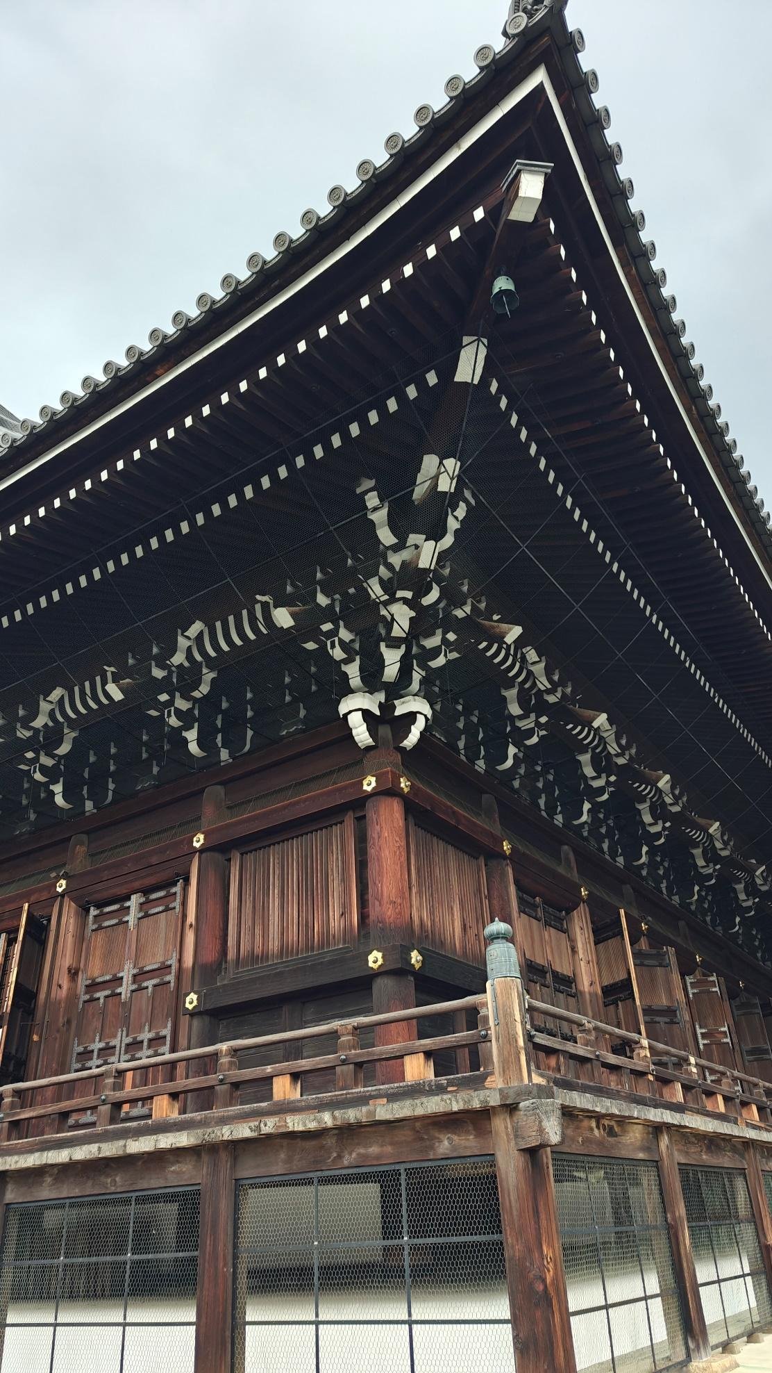 Intricate wooden temple roof with ornate carvings