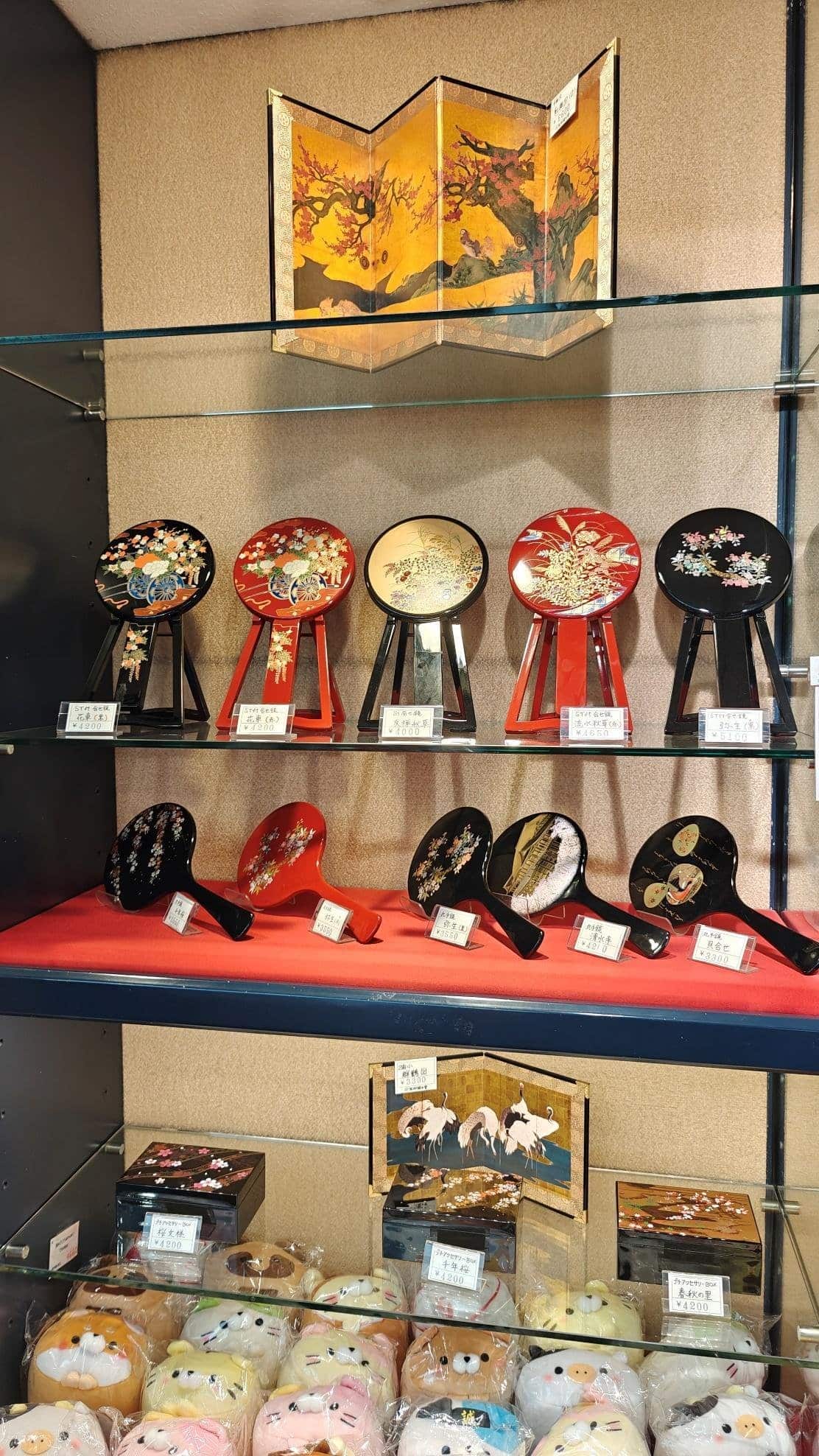 Japanese fans and decor on display shelves