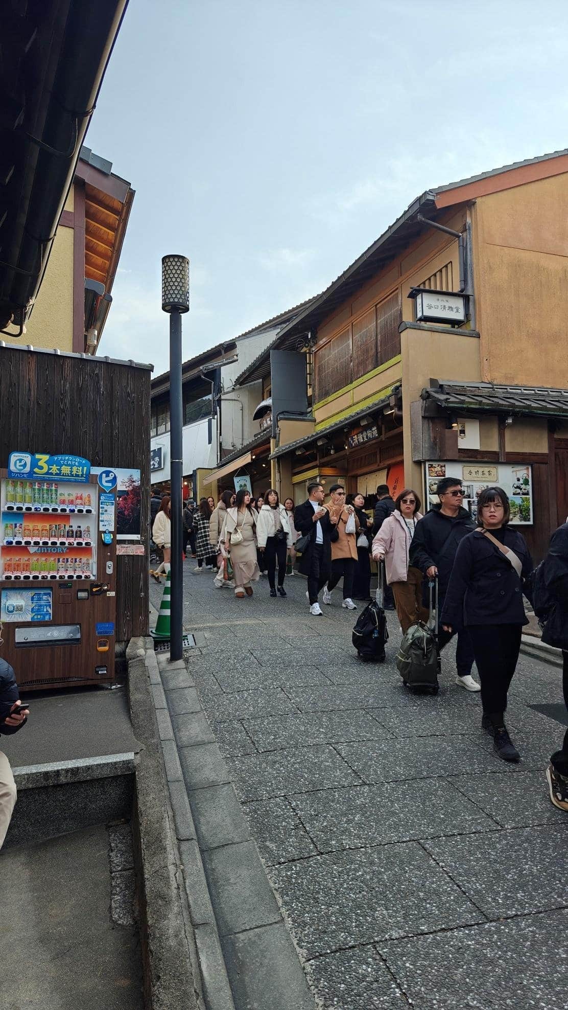 People walking in a bustling traditional street