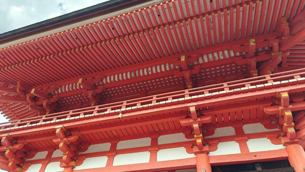 Red wooden temple roof with intricate beams