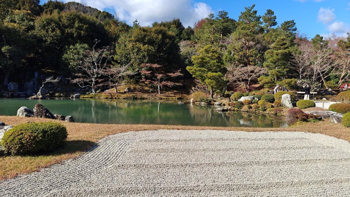 Serene Japanese garden with pond and lush greenery