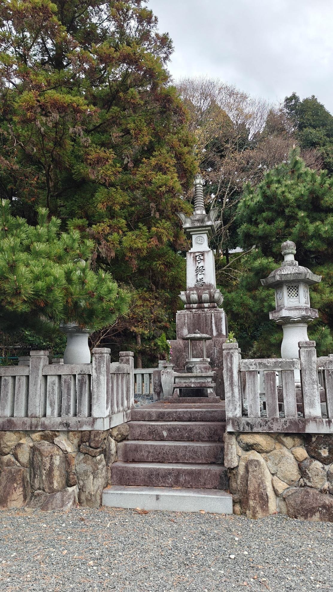 Stone pagoda surrounded by lush green trees