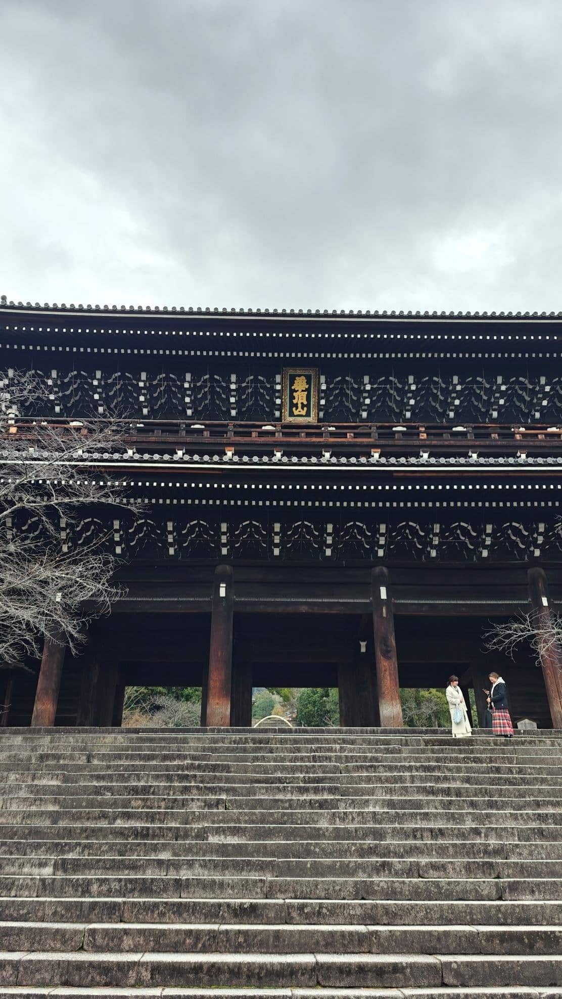 Stone steps leading to a traditional Japanese temple entrance