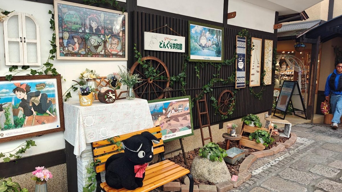 Studio Ghibli-themed shop with decorated wall and plush toys