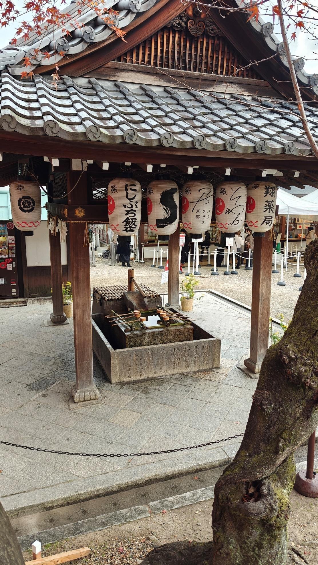 Traditional Japanese shrine with hanging lanterns