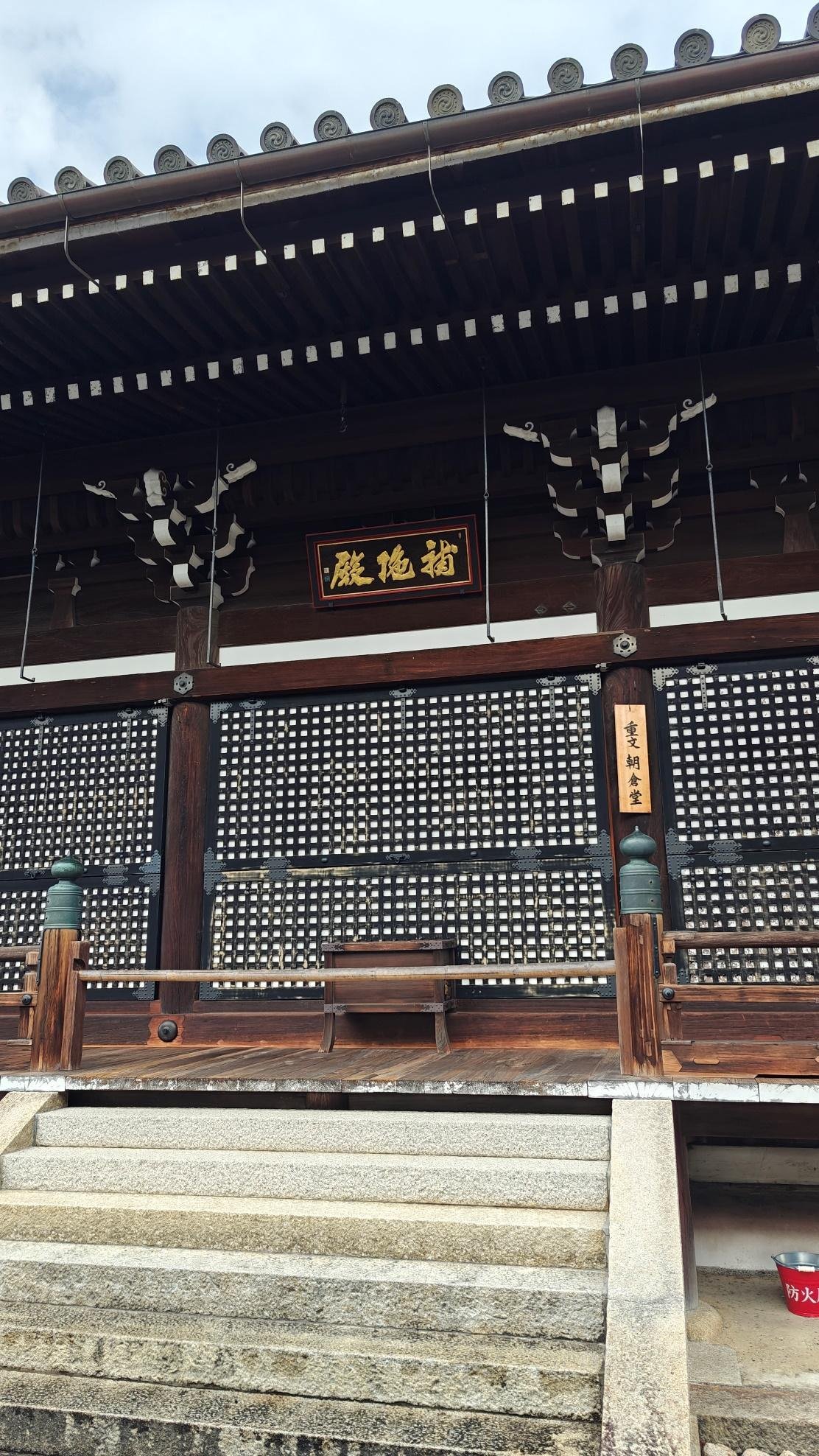 Traditional Japanese temple facade with wooden lattice design