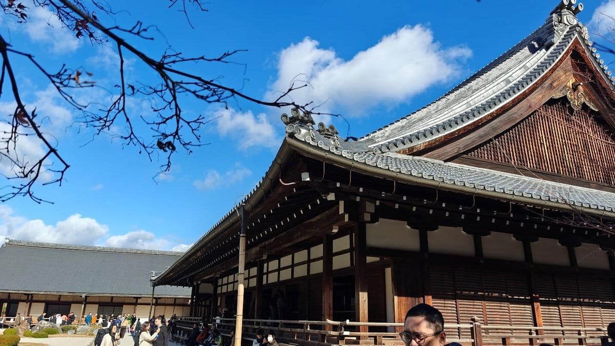 Traditional Japanese temple under a clear blue sky