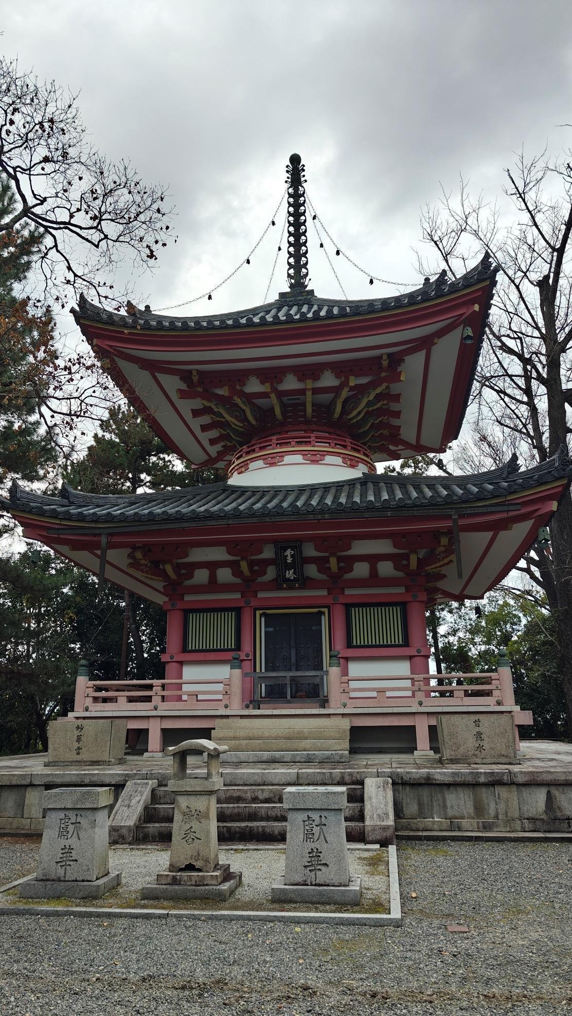 Traditional pagoda with ornate design and overcast sky