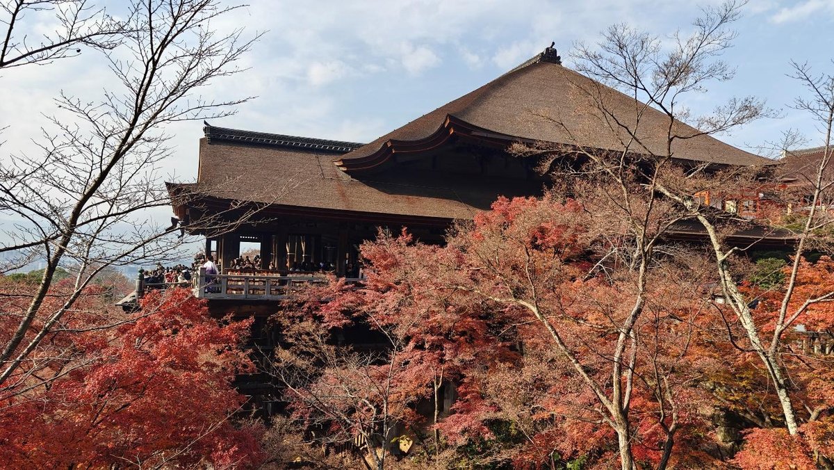 Traditional temple amidst autumn foliage