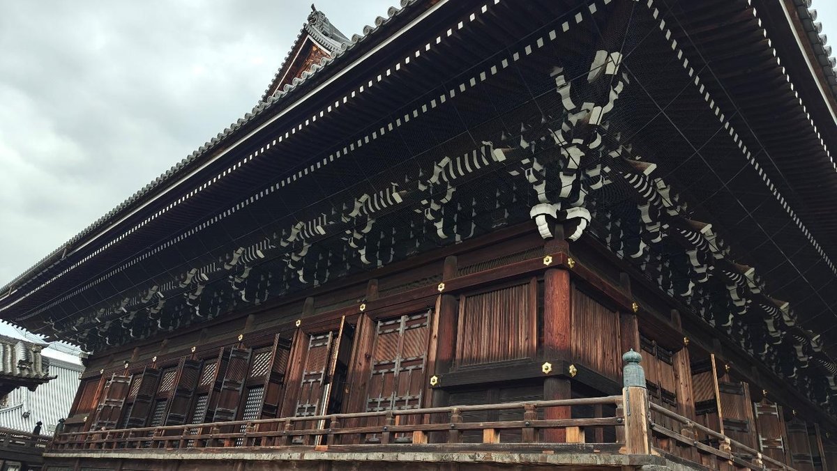 Traditional wooden Japanese temple with ornate roof details
