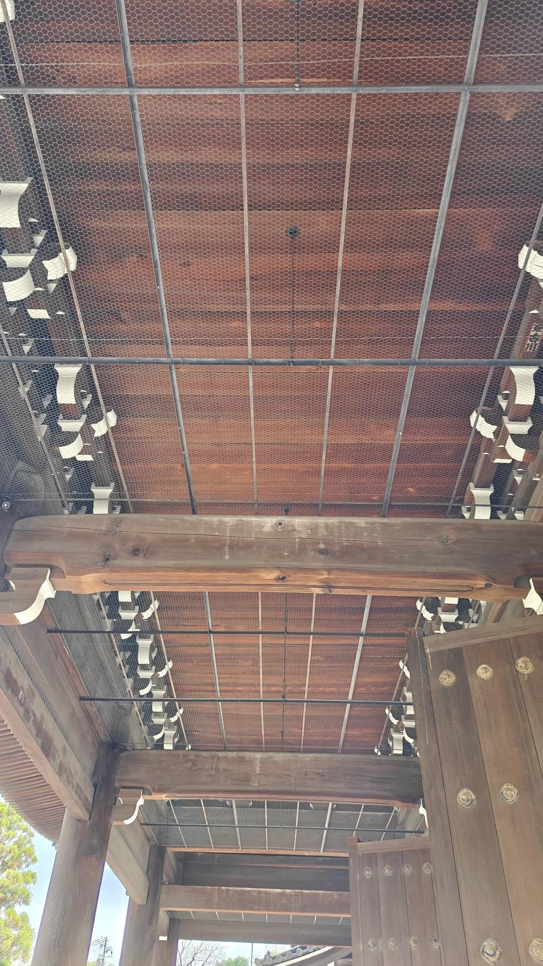 Wooden temple roof with intricate lattice design