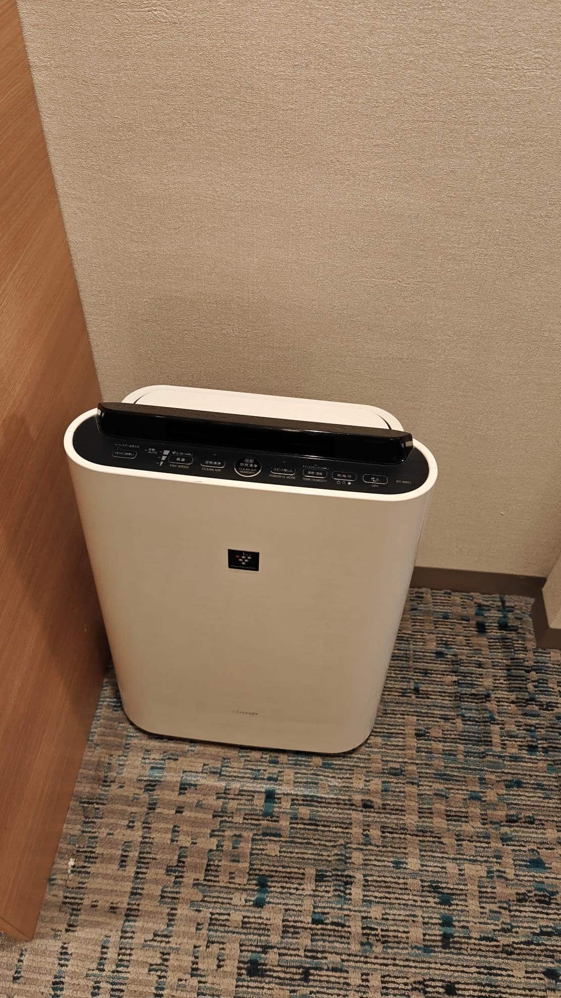 Air purifier on carpeted floor