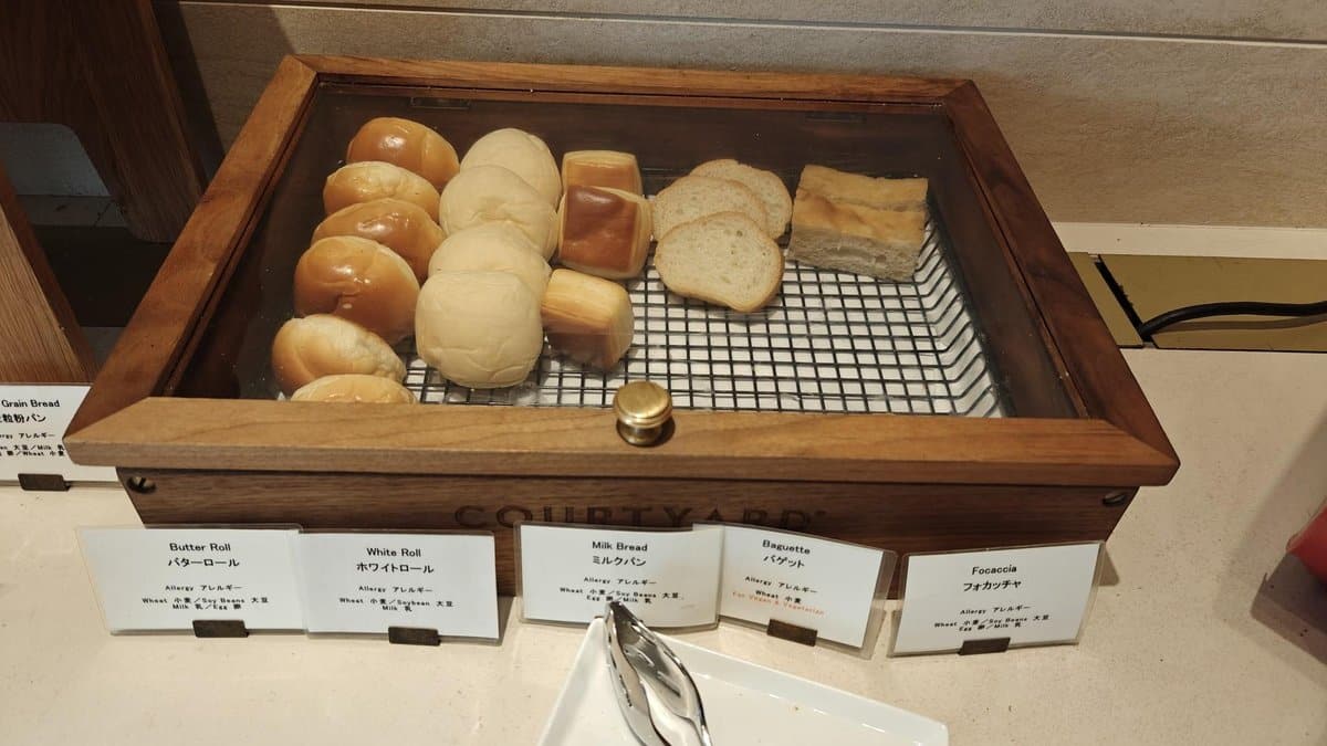 Assorted breads in wooden display case