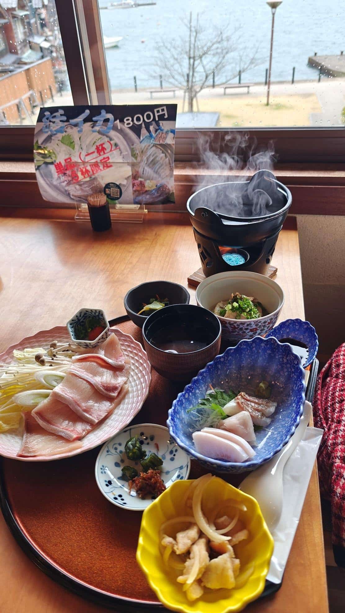 Assorted Japanese dishes by window view