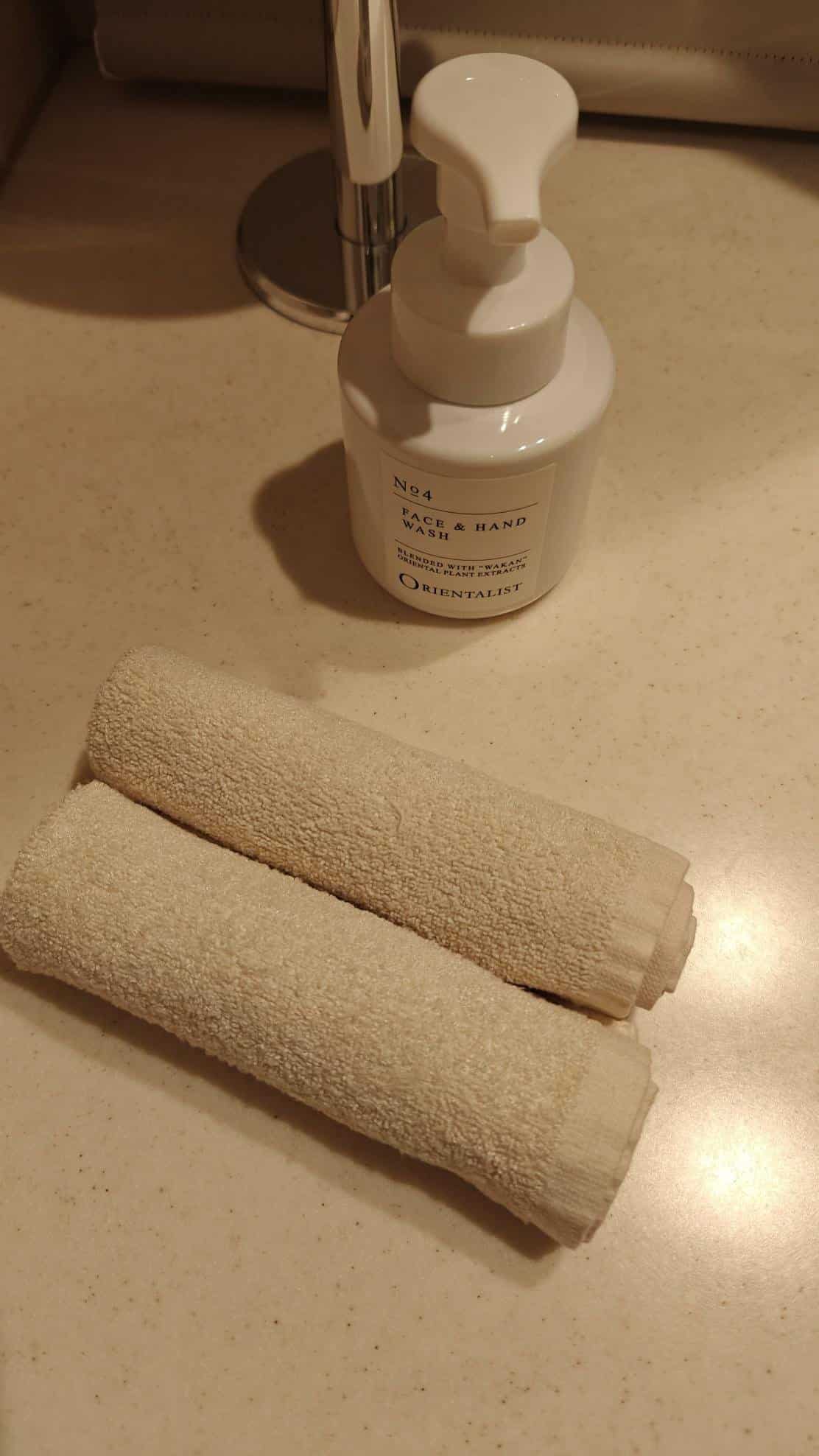 Bathroom soap and rolled towels