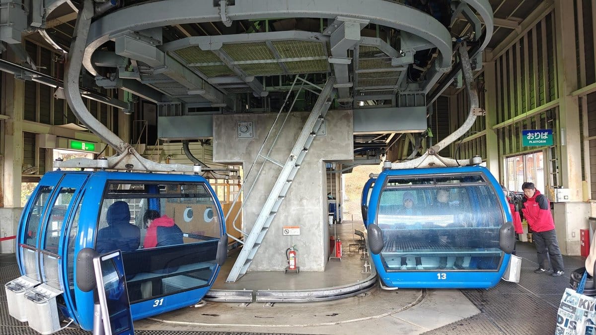 Blue gondolas at cable car station