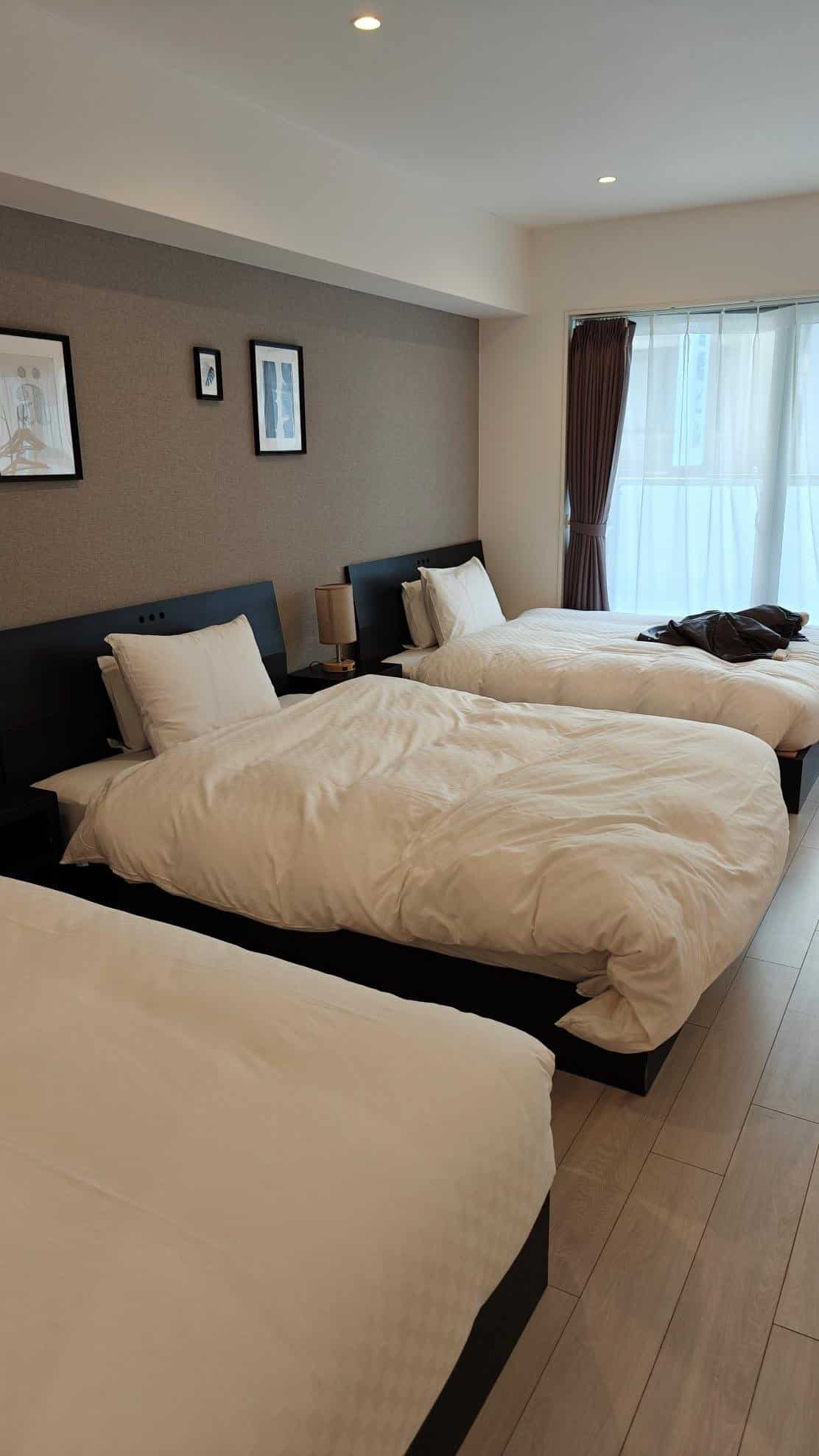 Bright room with three cozy beds