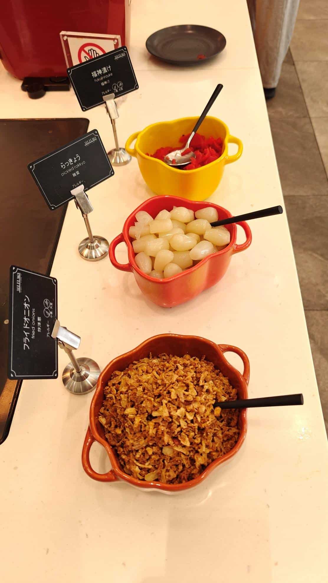 Buffet condiments with labels