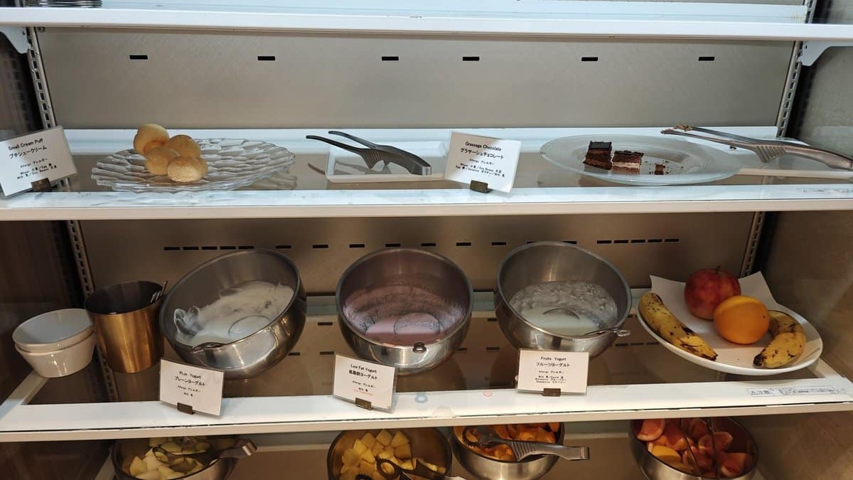 Buffet with assorted pastries and fruit