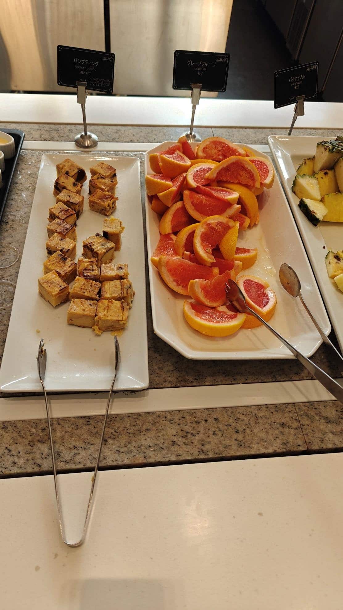 Buffet with grapefruit and bread pudding