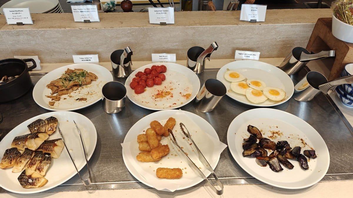 Buffet with variety of breakfast dishes
