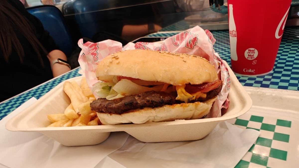 Burger and fries on checkered table