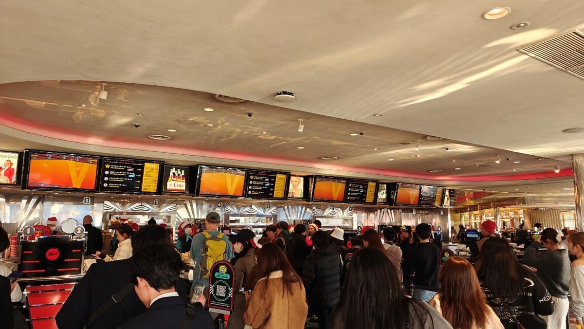 Busy food court with digital menus