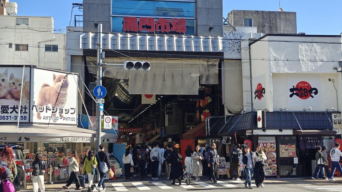 Busy street market entrance scene