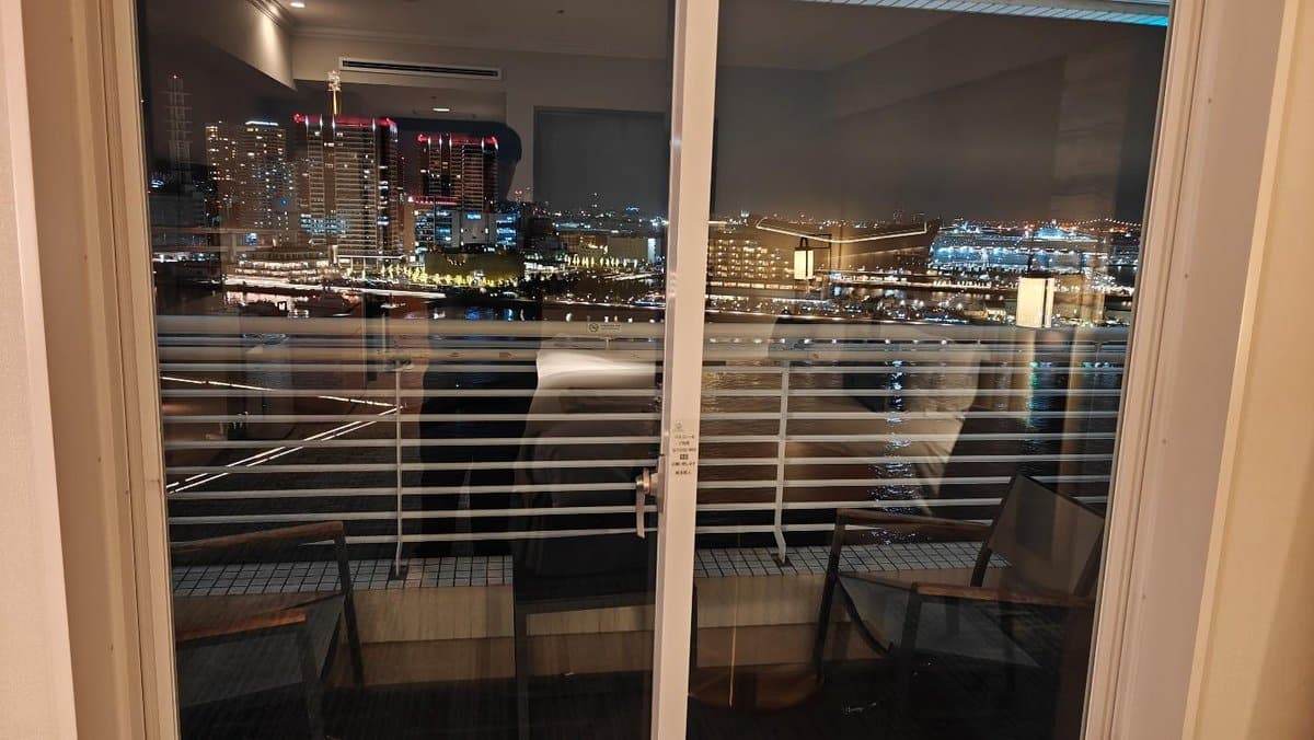 City skyline view through window at night