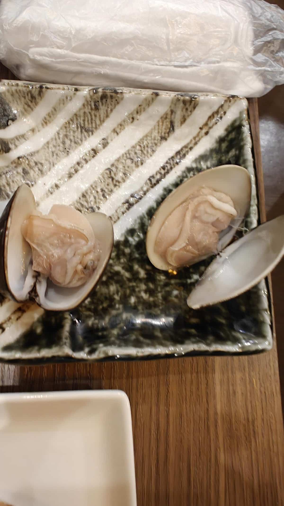 Clams on textured ceramic plate