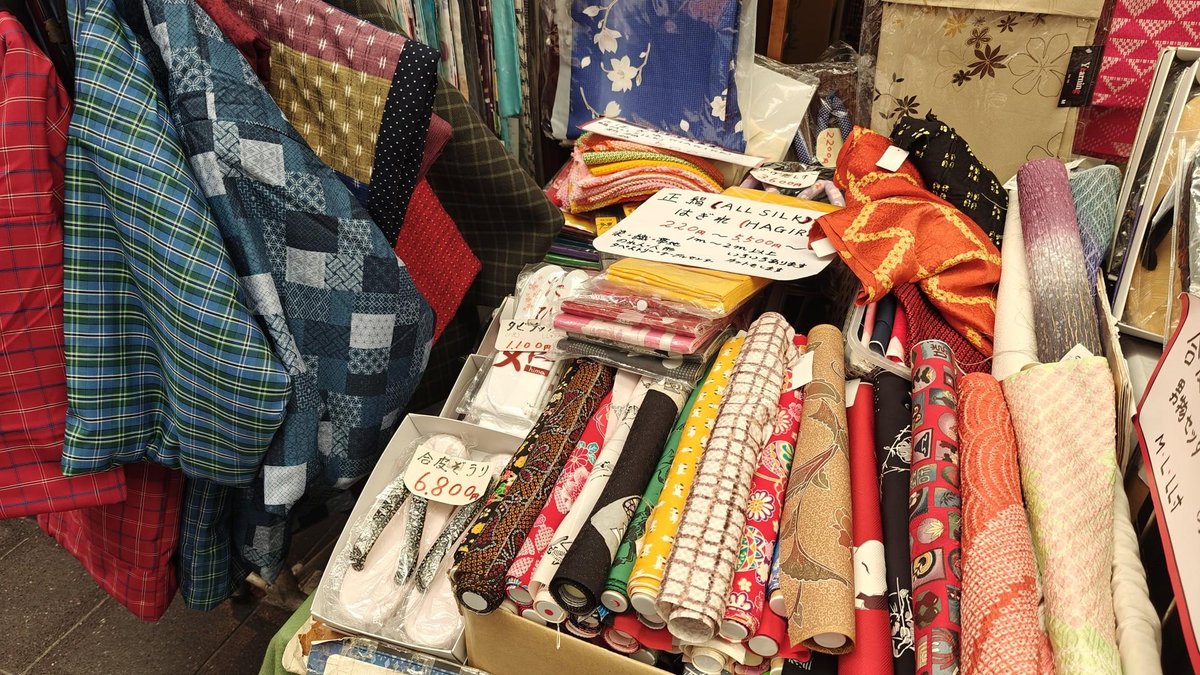 Colorful fabric rolls on display