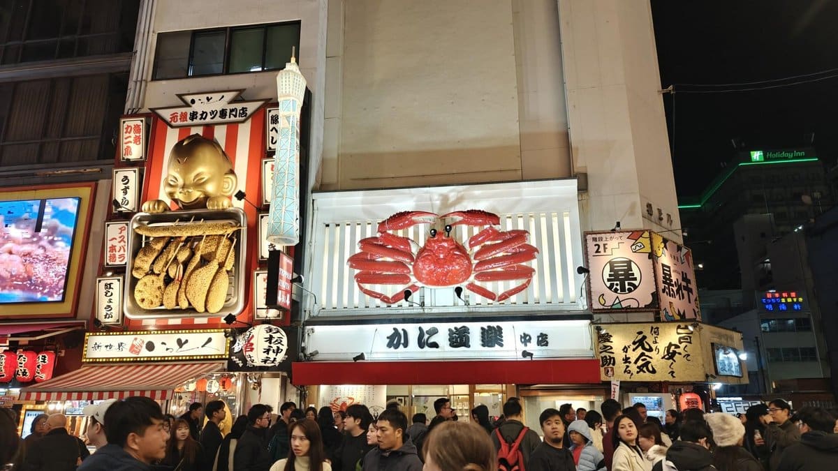 Colorful street scene with giant crab sign