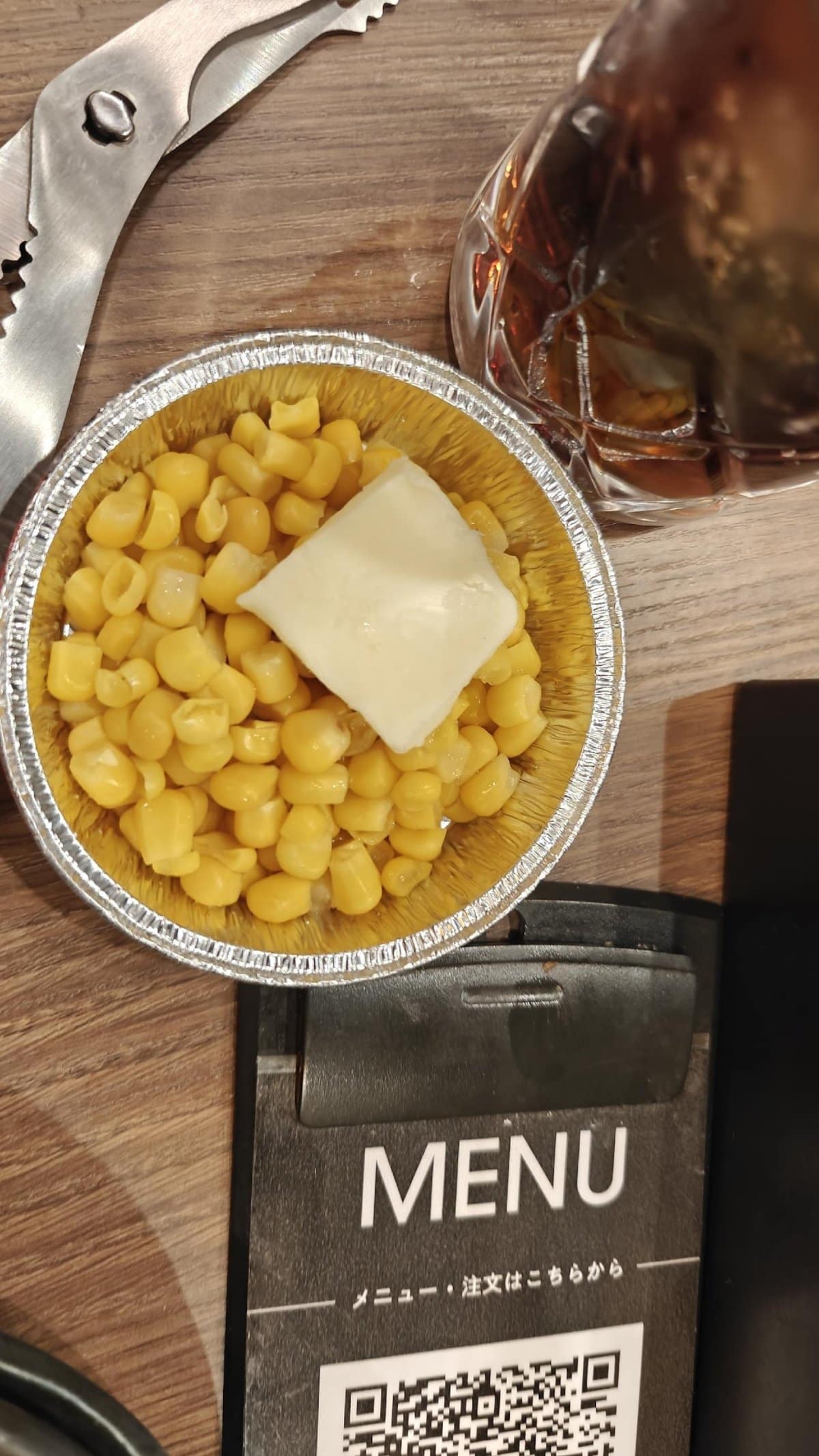 Corn with butter in foil cup